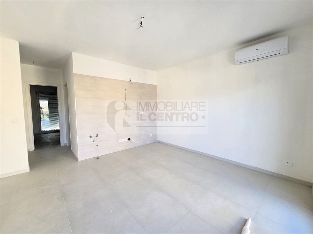 BILOCALE CON GIARDINO E UN POSTO AUTO